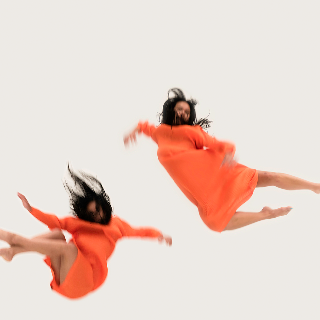 Four images of Amrita Hepi mid-air, mid-dance pose, stitched together to look as if she is flying through the air
